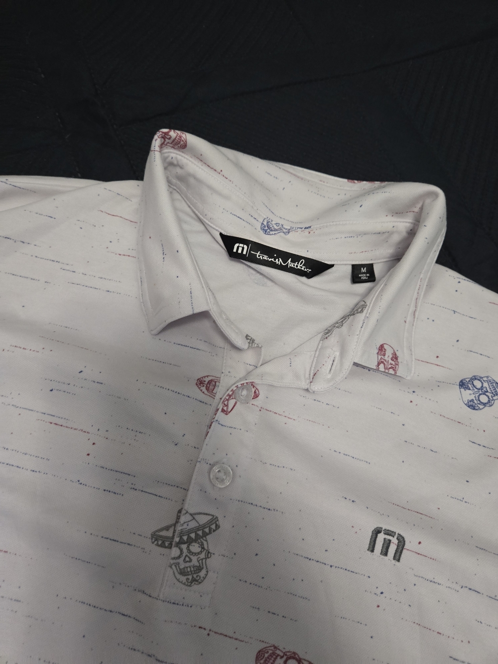Men's White Printed Polo Shirt by Travis Mathew - Skull Motif